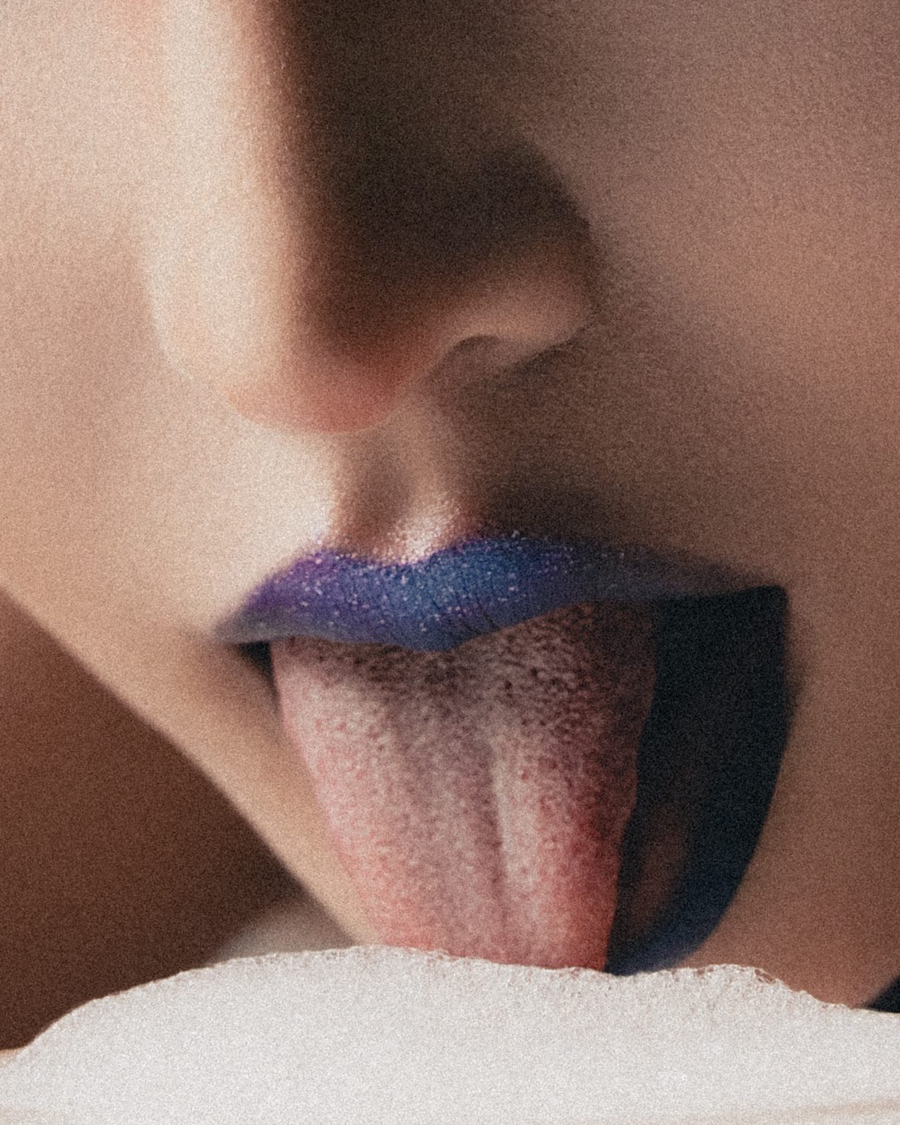 Detail of blue glitter lips and tongue
